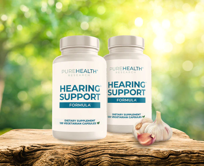 Two bottles of PureHealth Research Hearing Support Formula on a wooden surface, promoting the best supplements for hearing loss.