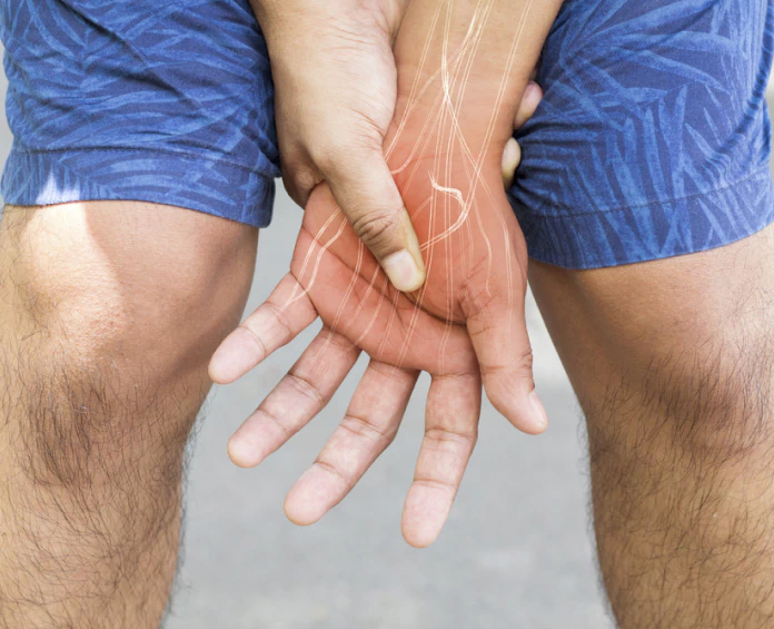 A person holding their wrist with highlighted nerves, symbolizing the role of nervous system supplements in maintaining nerve function.