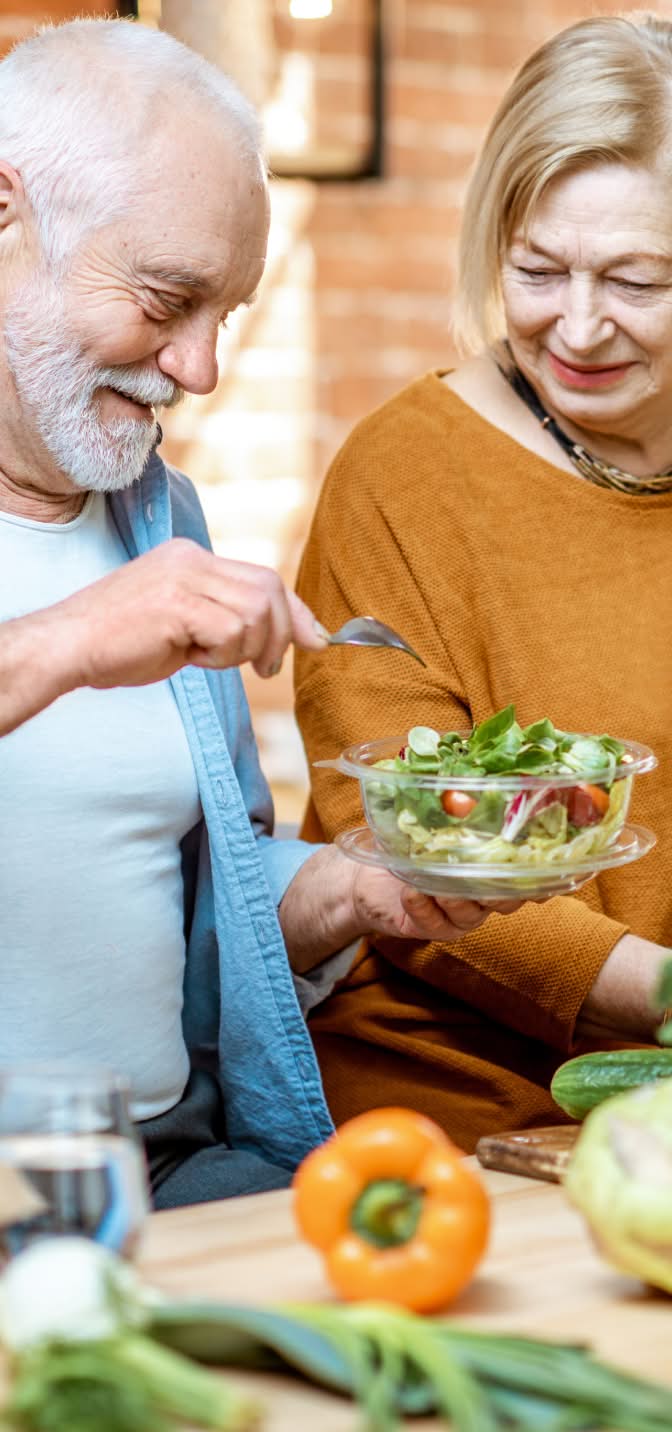 Couple making a salad